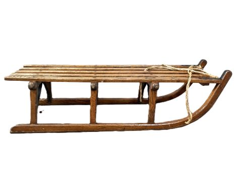 A vintage sled marked Davos 28 x 104 x 37 cm