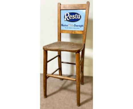An early 20th c. elm and beech kitchen chair with a metal enamel Restu advertising panel, and chair with a A Janes &amp; Sons