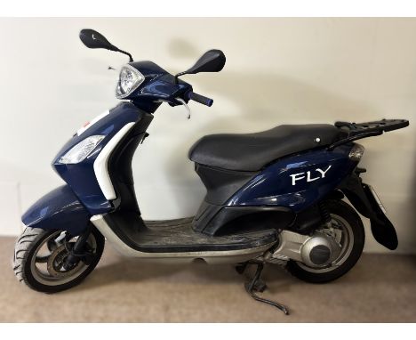 A Piaggio Fly 125 scooter, first registration 2010, 124 cc, oedometer reads 26454 KM.