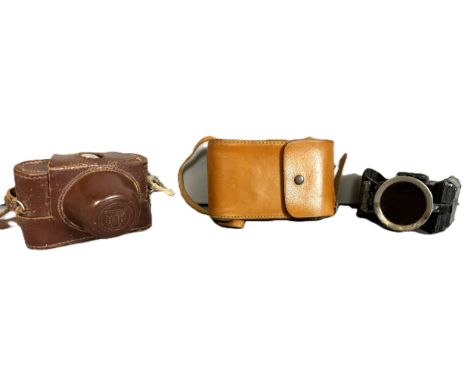 A Kodak Brownie camera, a AKA Relle camera and a H Miller Lumo bicycle lamp, (3).  The Alastair & Sheila Brooks Collection: o