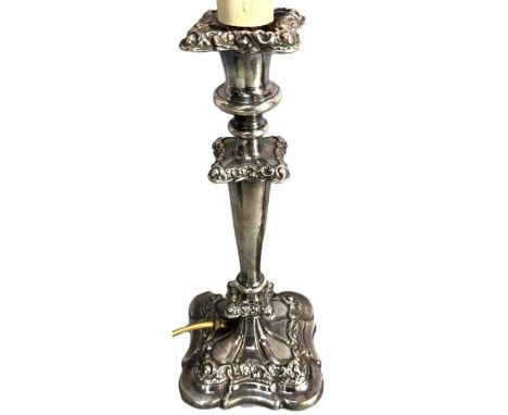 A pair of early 20th c. silver plated candlsticks converted to electricity, 32 cm to top of lamp holder.  