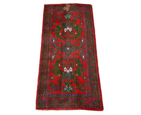 A turkoman style runner, 185 x 82 cm and another runner with green and blue scrolling design on red field, 180 x 91 cm, (2).