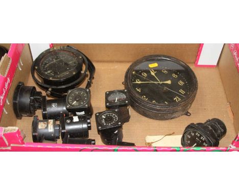 An early 20th century ship's compass on a gimbal mount; together with a bulkhead clock, and various instrument dials