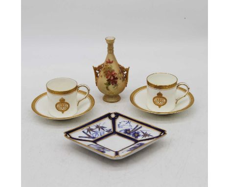 A pair of Royal Worcester coffee cans, each decorated with gilt borders, together with a Worcester blush ivory vase, height 1