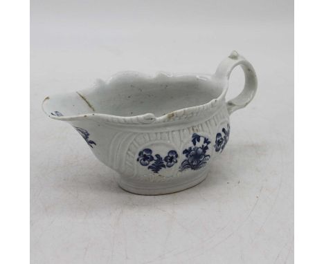 An 18th century Worcester blue &amp; white sauce boat, decorated with flowers, length 19cm