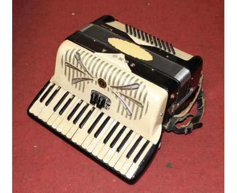 A vintage Sonia pearloid cased piano accordion