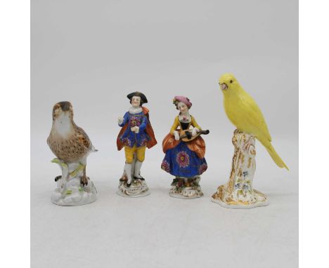A Royal Worcester figure of a budgerigar, 16cm high, together with three other ceramic figures