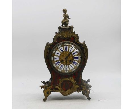 A 19th century French red tortoiseshell and boulle inlaid 8-day mantel clock, having enamelled Roman numeral cartouches and R