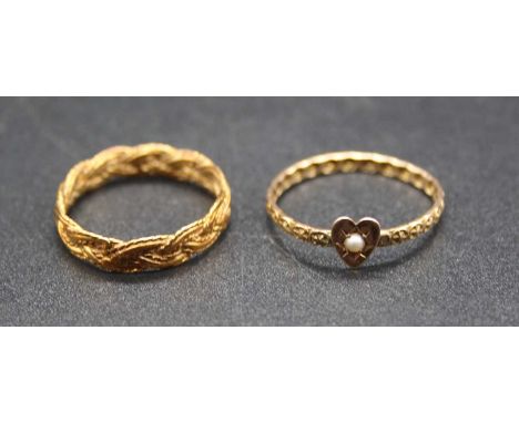 A 9ct gold carved band ring, with seed pearl heart shaped setting, size Q; together with a yellow metal intertwined ropetwist