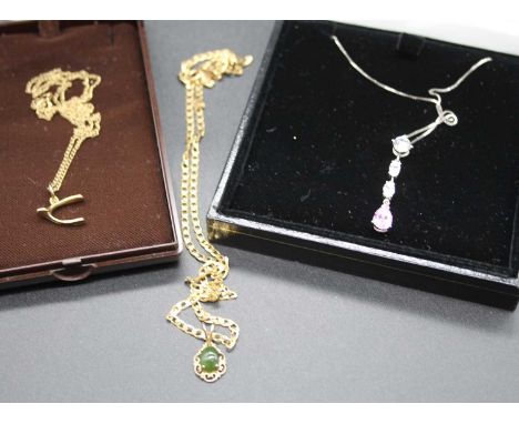 A 9ct gold finelink necklace, with wishbone pendant, 1.8g; together with a 9ct white cz and pink stone set pendant, on fineli