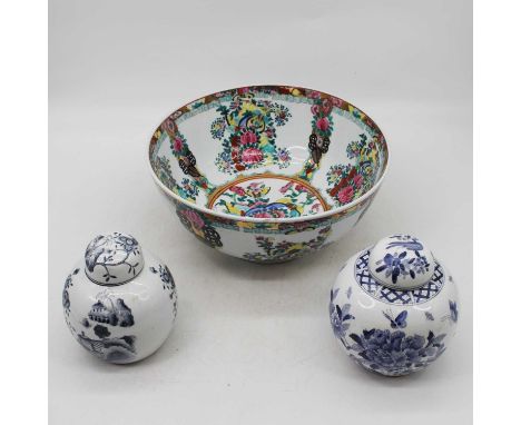 A Chinese porcelain bowl, gilt and enamel decorated with flowers, dia. 31cm, together with a near pair of Chinese blue &amp; 