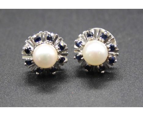 A pair of 14ct white gold, cultured pearl and sapphire set ear studs, in flower head settings, 3.5g, dia.12mm 