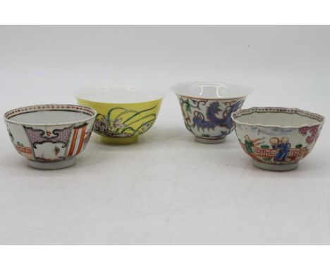 A 19th century Chinese porcelain tea bowl, enamel decorated with figures, dia. 9cm, together with another similar, and two fu