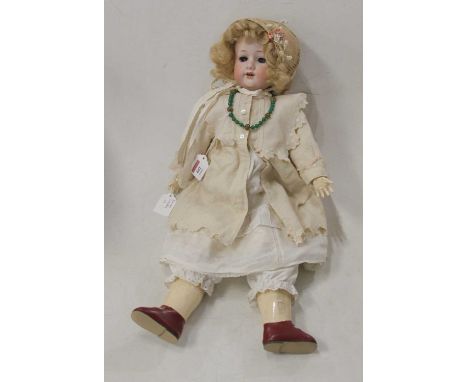 An early 20th century Simon &amp; Halbig German bisque head doll, having painted brows and lashes, with fixed blue eyes, open