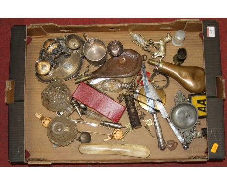 A box of items to include a copper powder flask, pewter twin handled quaich, and silver plated cutlery 