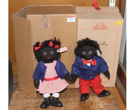 A Steiff Golly boy figure having a button to ear and white label numbered 00469 together with one other Golly girl example 01