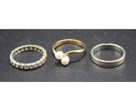 A modern 9ct gold and cultured pearl set crossover ring, size L; together with a 9ct white gold band ring; and a 9ct white go