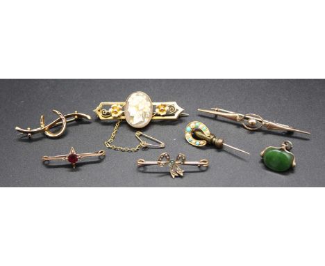 Assorted Victorian and later yellow metal bar brooches, to include a turquoise and seed pearl set safety pin example, garnet 