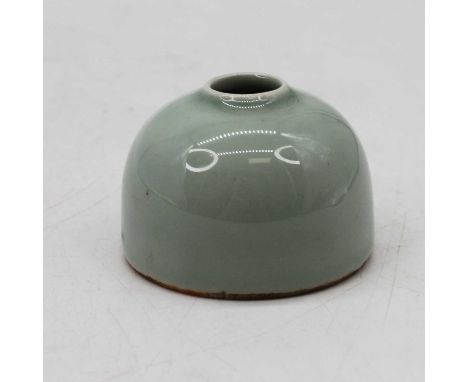 A Chinese celadon glazed inkwell, bearing seal mark to the underside, height 4.5cm Appears to be in good condition.Free from 