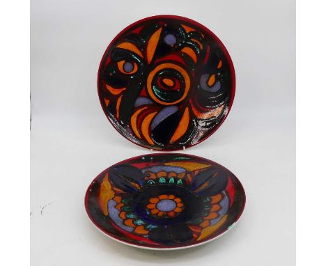 A Poole Pottery charger, polychrome decorated with abstract shapes, dia. 36cm, together with another similarBoth in good cond