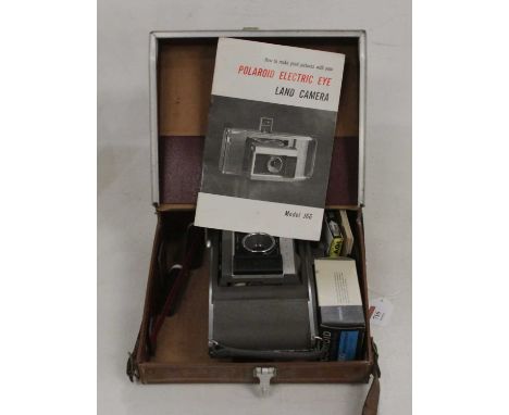 A Polaroid electric eye land camera, model J66, in leather case with accessories