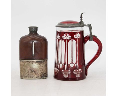 A ruby overlaid glass and pewter mounted tankard having a hinged lid with thumbpiece, height 19cm, together with a glass hip 