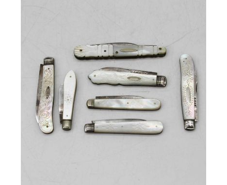 Seven Victorian mother-of-pearl handled fruit knives, six having silver blades, a 20th century crocodile-skin note holder wit