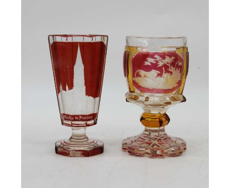 A 19th century Bohemian ruby and amber overlaid glass goblet, height 14cm, together with another similar, height 14cm