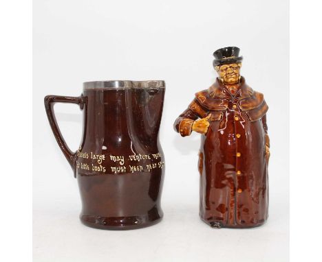 A Royal Doulton treacle glazed figural bottle, height 26cm, and a similar Royal Doulton treacle glazed jug, having a silver r