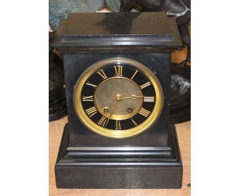 A 19th century black slate mantel clock, the chapter ring showing gilt Roman numerals, having 8-day movement, height 40cm