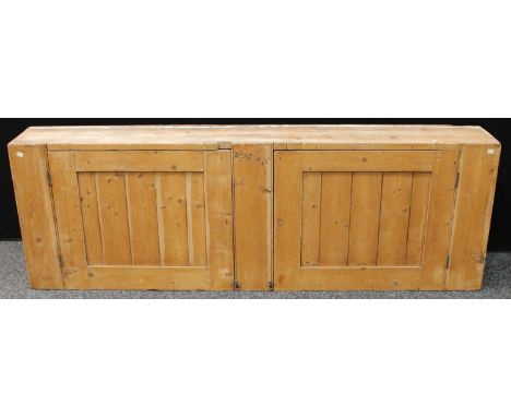 A Farmhouse pine wall cabinet, rectangular top above a pair of cupboard doors, each enclosing shelf, 182.5cm wide