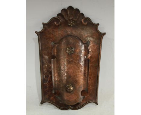 An Arts and Crafts beaten copper wall light