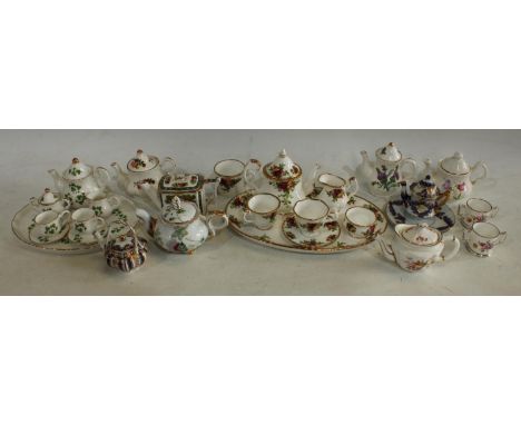 A Royal Albert Old Country Roses pattern miniature tea set on tray; a Royal Crown Derby miniature Posies pattern teapot, 7cm;