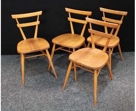 A set of four Ercol 'Green Dot' stacking chairs (4)
