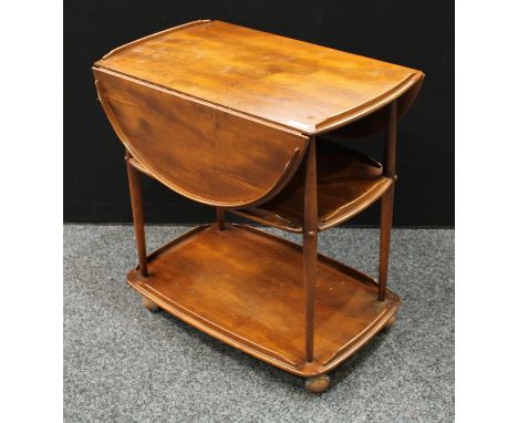 An Ercol elm serving/drinks trolley