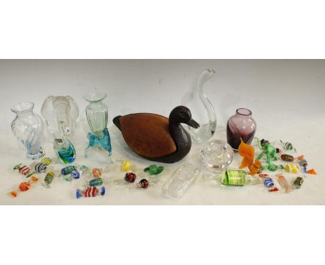 A novelty swimming duck table lamp; a Mats Jonasson engraved elephant; Murano glass sweets; Caithness small vases; a glass mo