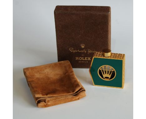 A Rolex scent bottle, Perpetually Yours, Geneva, with contents, the angular gilt metal bottle with green enamel panel, circul