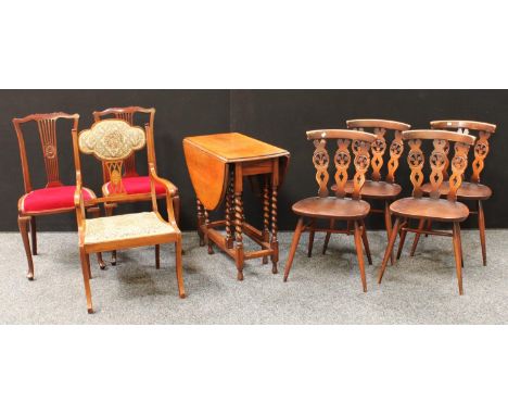 A set of four Ercol dining chairs; an oak barley twist gateleg table; a pair of early 20th century mahogany side chairs; anot