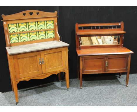 An Arts &amp; Crafts oak washstand, the gallery set with Art Nouveau design tiles, retailed by J. White &amp; Sons, Chesterfi