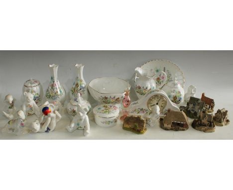 An Aynsley Wild Tudor pattern mantel clock, vase and cover, animal models, pair of bottle vases, plate, jug; four Lilliput La