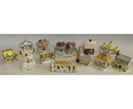 A Coalport model cottage, Thatched Cottage, 10cm, printed mark; others, The Master's House; Swiss Cottage; The Gate House; Sh
