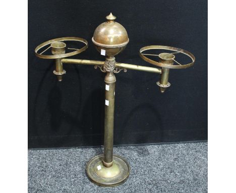 A brass two branch table lamp, the central column crested with an orb, 76cm high