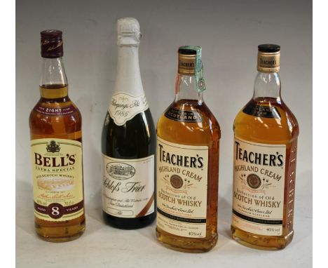 A bottle of Teacher's Highland Cream whisky, 75cl; another; a bottle of Bell's Scotch whisky, 75cl; a bottle of Schloss Trier