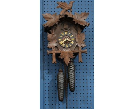 A German Black Forest style cuckoo clock, weights, pendulum