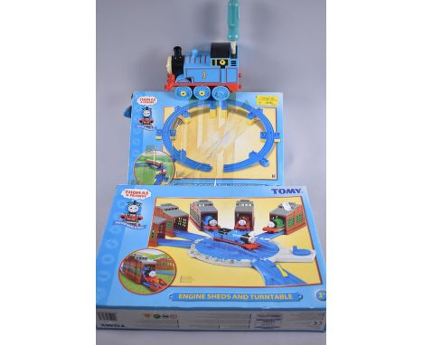 A Tomy Thomas The Tank Engine Shed and Turntable Set, Sloping Curved Rail Accessory Kit and a Battery Operated Thomas The Tan