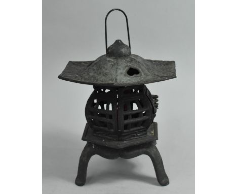 A Modern Cast Iron Oriental Tea Light Stand in the Form of a Pagoda, 33cms High 