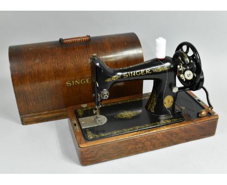 A Wooden Cased Manual Singer Sewing Machine 
