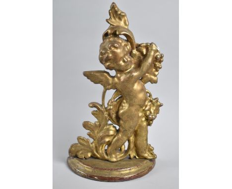 An Enamelled and Gilt Decorated Cast Iron Fire Tidy in the Form of Cherub with Bunch of Grapes, No Fire Tools, 34cms High 