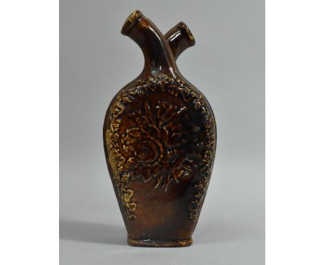 A Treacle Glazed Ceramic Double Gimmel Flask, Moulded Floral Design, 18cm high 