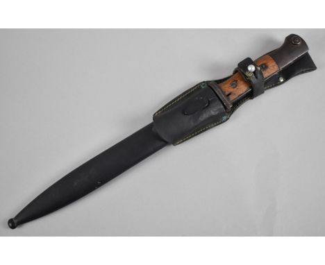 A WWII Third Reich K98K Bayonet with Wooden Handle and Blade Numbered 167 42. Steel Scabbard and Leather Frog 